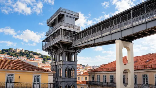 The neo-Gothic iron tower of the Santa Justa Lift in Lisbon's Baixa, with the walkway linking it to Carmo