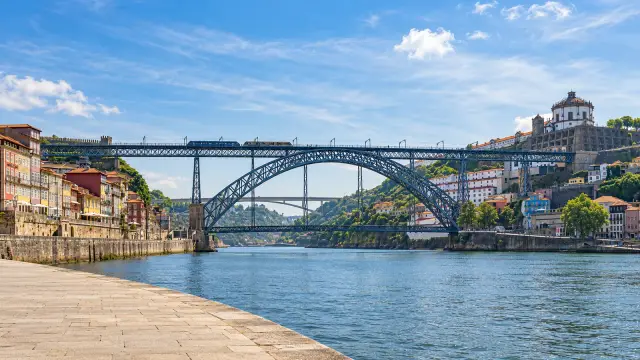 Porto's Dom Luís I Bridge, an iron arch with two decks over the River Douro, seen from the Ribeira