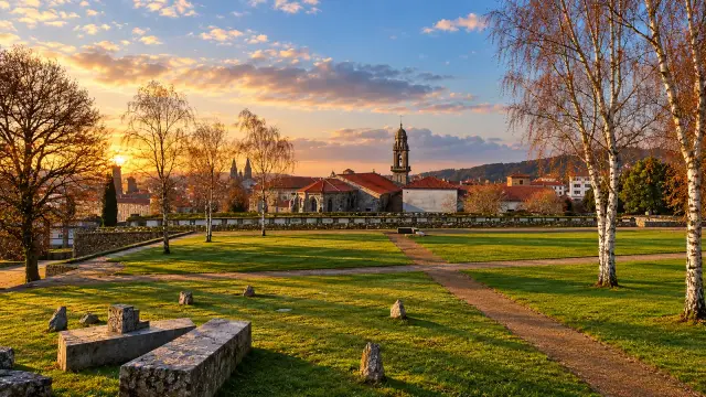 Stone-walled terraces and trees in Bonaval Park, Santiago de Compostela, in the evening light
